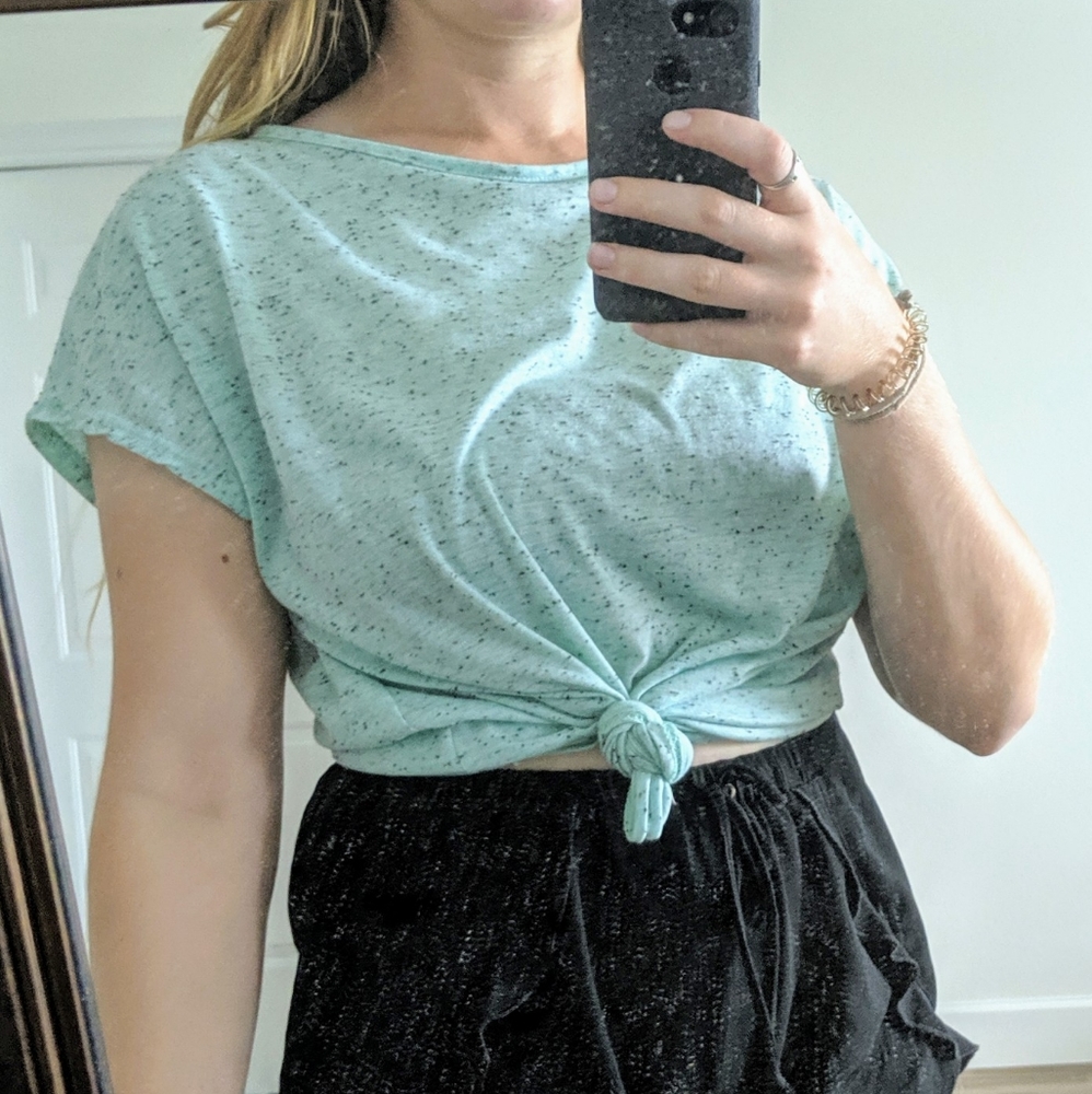 Mint colored talk with black specks